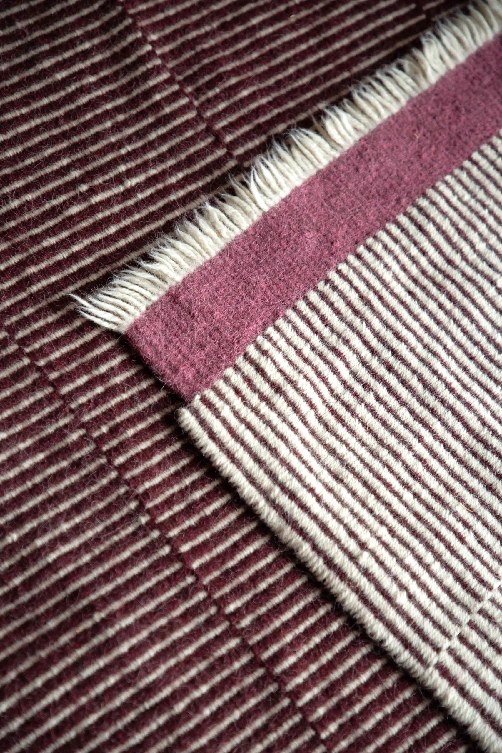 Tapis en laine rose